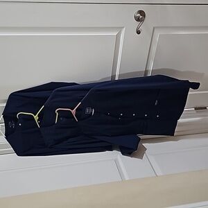 Three blue nursing scrub jackets